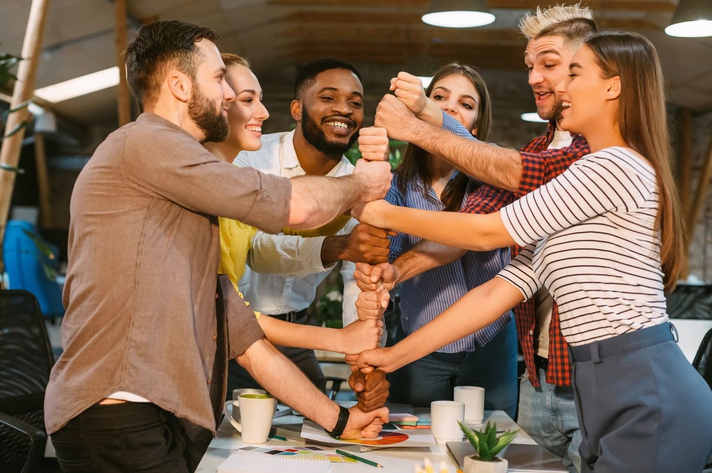 A team with their hands stacked together